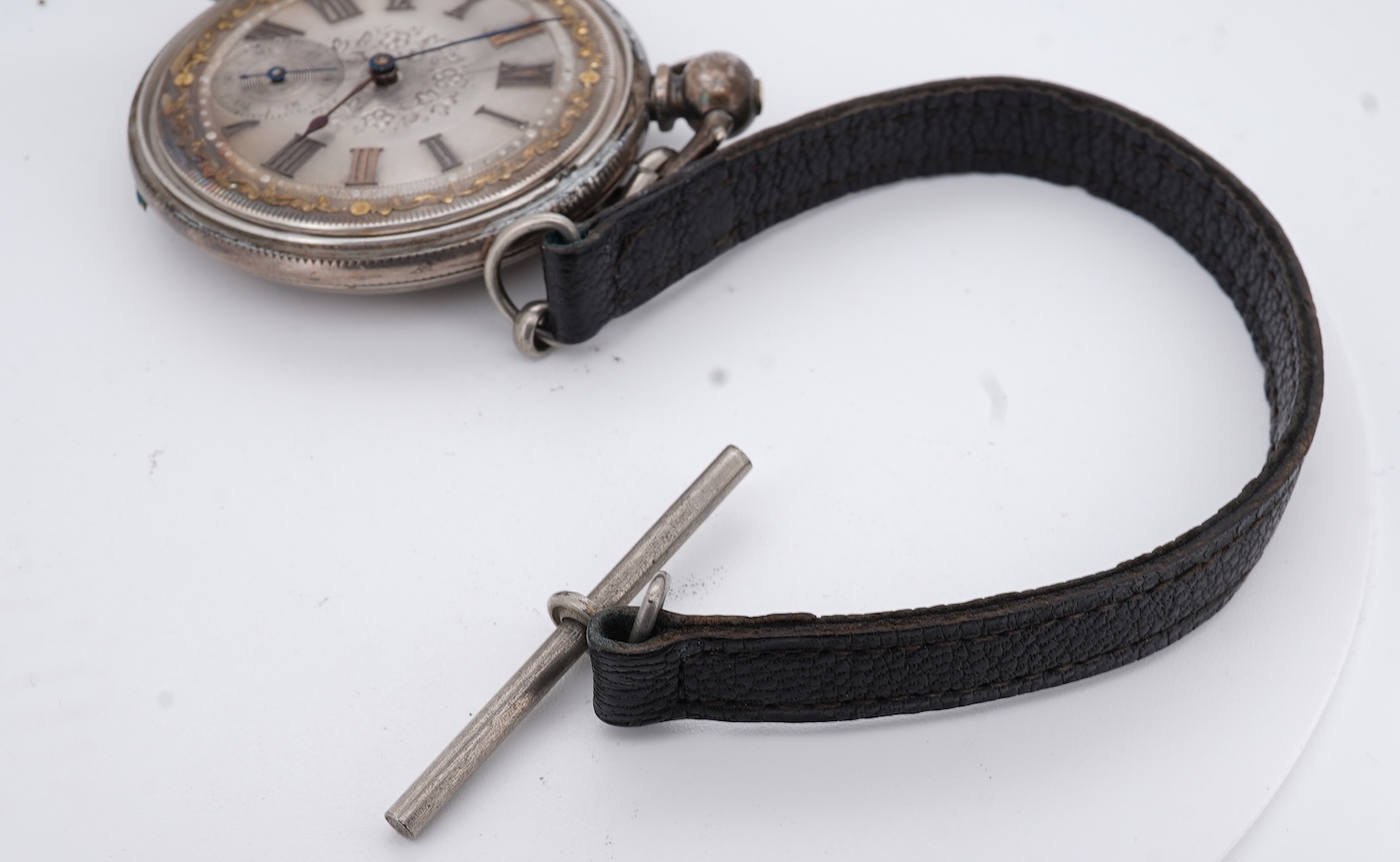 An early 20th century continental 800 standard white metal open faced chronograph pocket watch, with Roman numerals and two subsidiary dials, case diameter 50mm, together with a similar smaller white metal open faced poc